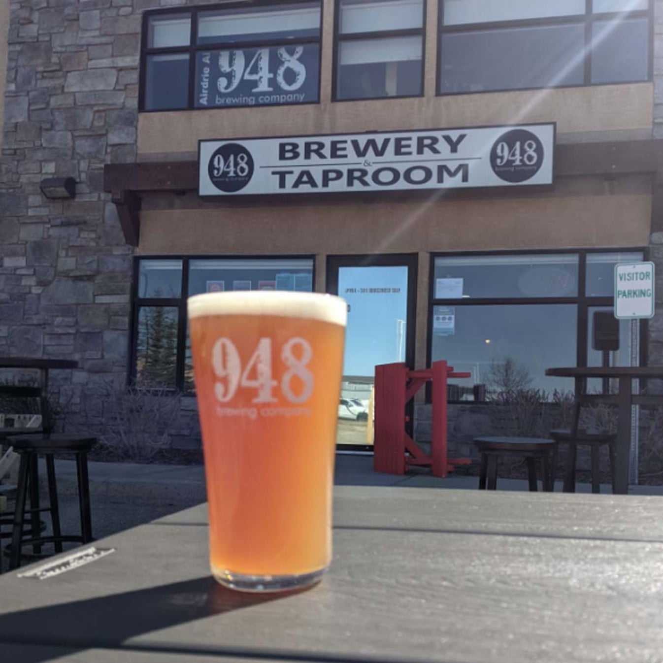 a full 948 beer mug on the outside patio of the 948 Brewing Company